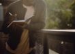 guy-writing-on-bridge